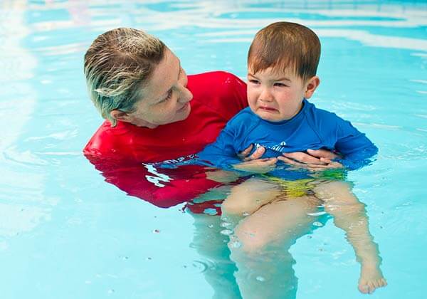 Boy crying during swim lesson